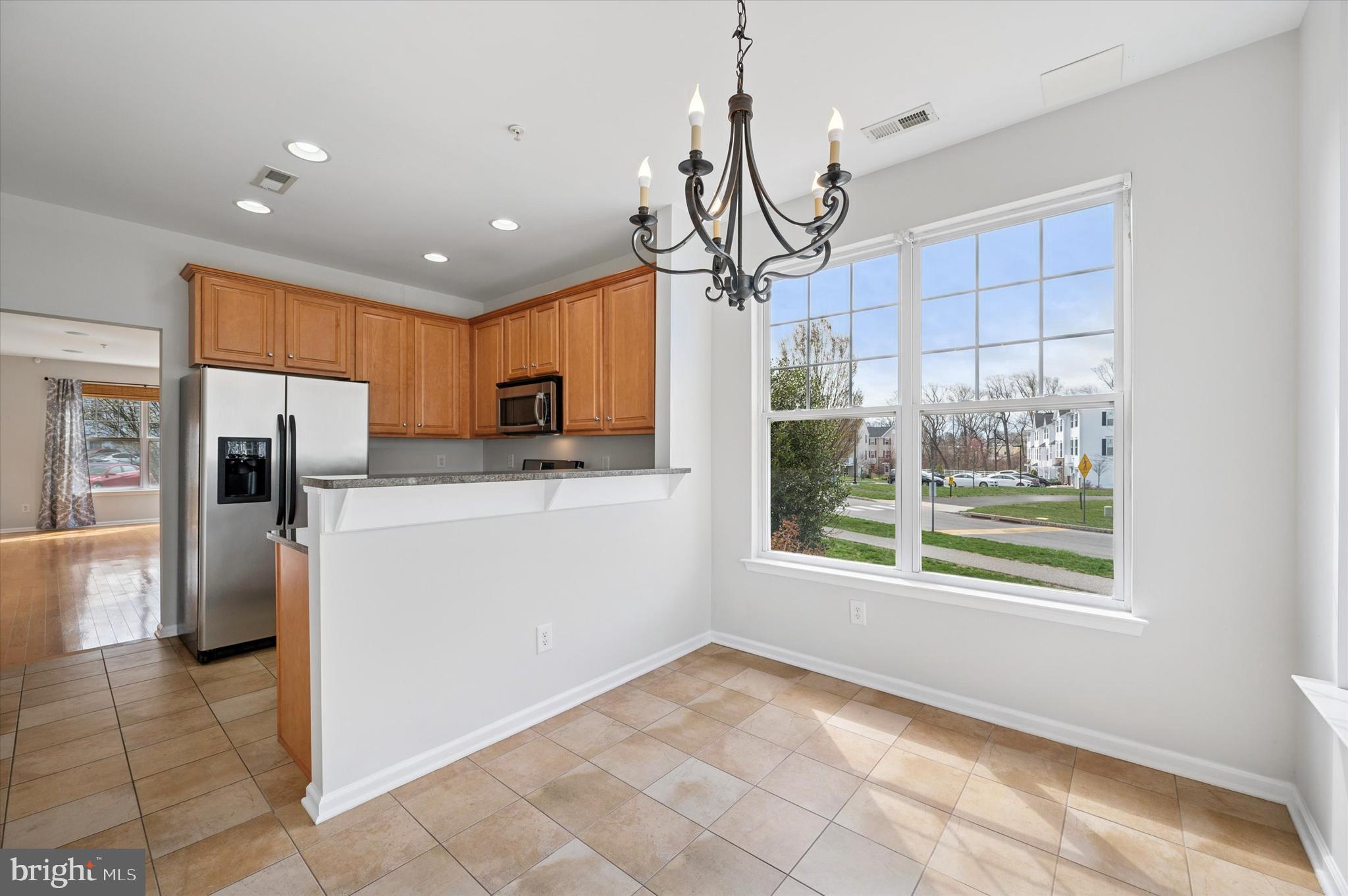 1 Old Cedarbrook Road Wyncote, PA 19095 - Photo 9 of 17 a view of a kitchen with refrigerator and microwave