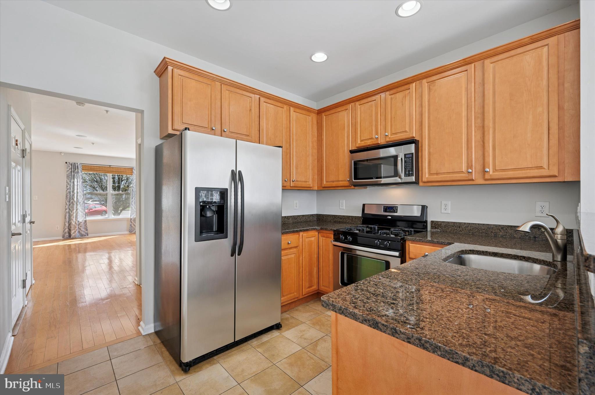 1 Old Cedarbrook Road Wyncote, PA 19095 - Photo 10 of 17 a kitchen with stainless steel appliances granite countertop a refrigerator a stove top oven a sink and dishwasher