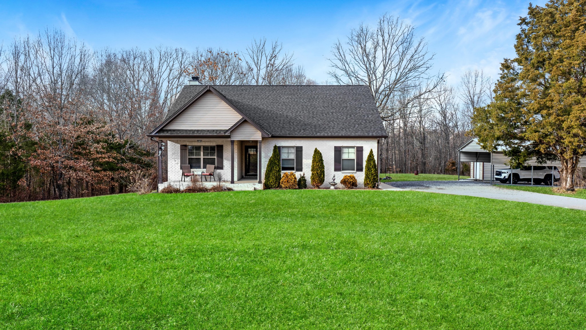 1743 Rapids Road Portland, TN 37148 - Photo 1 of 27 a front view of a house with yard and green space