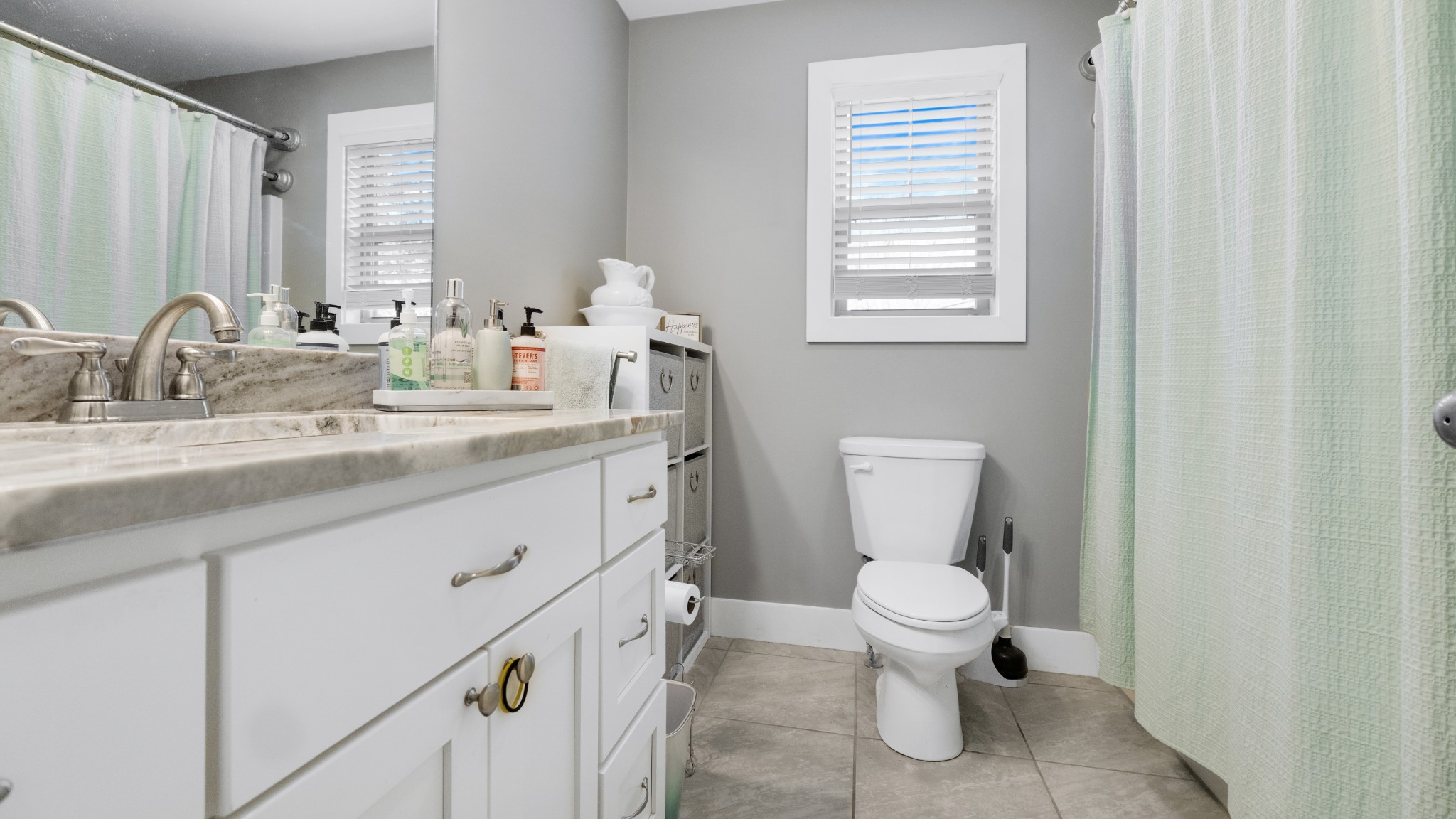 1743 Rapids Road Portland, TN 37148 - Photo 6 of 27 a bathroom with a granite countertop toilet sink and mirror