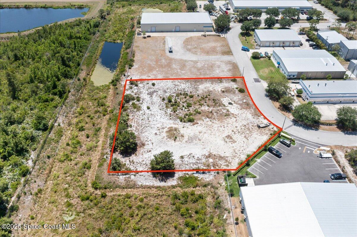 3041 Oxbow Circle Cocoa, FL 32926 - Photo 1 of 6 an aerial view of a house with a swimming pool
