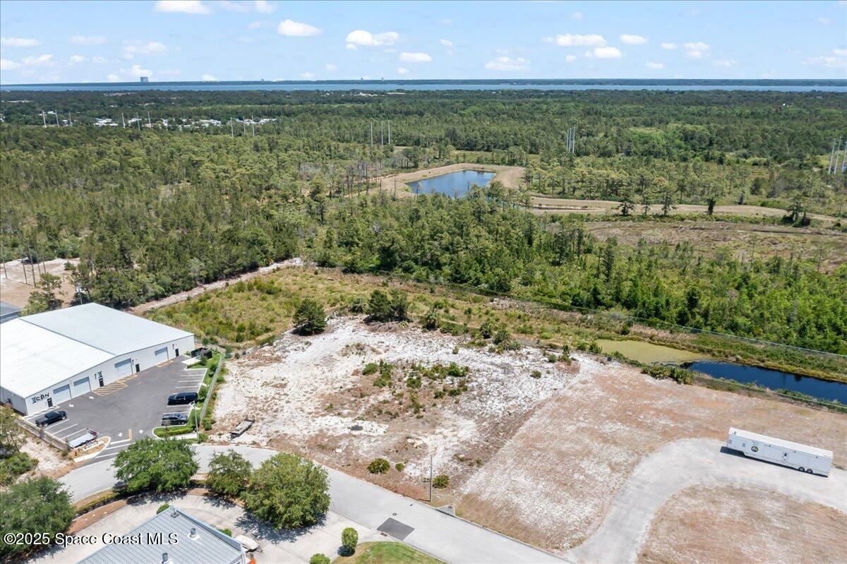 3041 Oxbow Circle Cocoa, FL 32926 - Photo 2 of 6 an aerial view of residential houses with outdoor space and street view