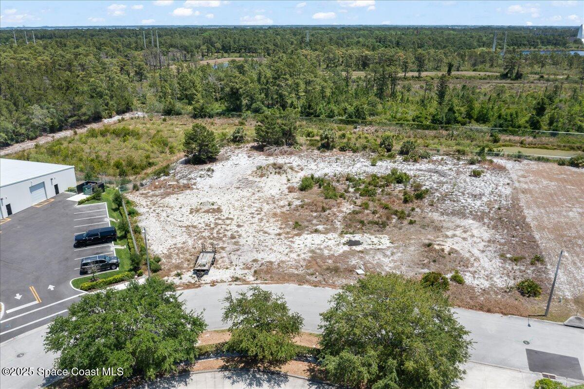 3041 Oxbow Circle Cocoa, FL 32926 - Photo 3 of 6 an aerial view of a house with a yard