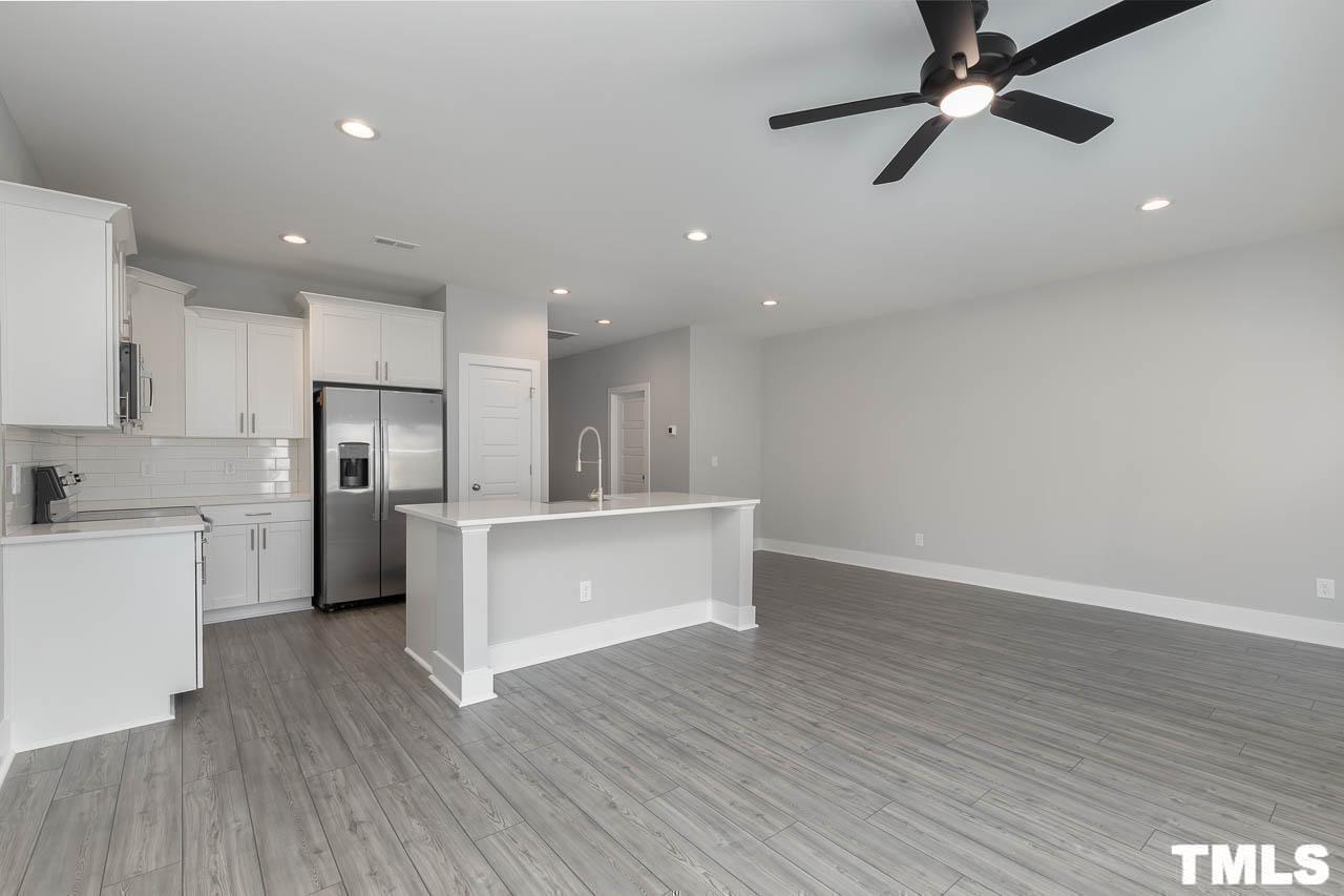 4 South Laird Drive, Unit 7 Clayton, NC 27520 - Photo 21 of 26 a view of kitchen with refrigerator microwave and stove