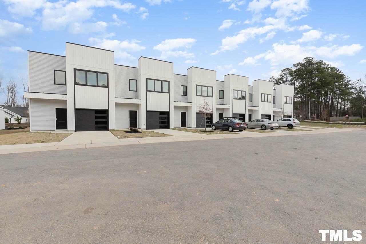 4 South Laird Drive, Unit 7 Clayton, NC 27520 - Photo 7 of 26 a view of city street with tall buildings