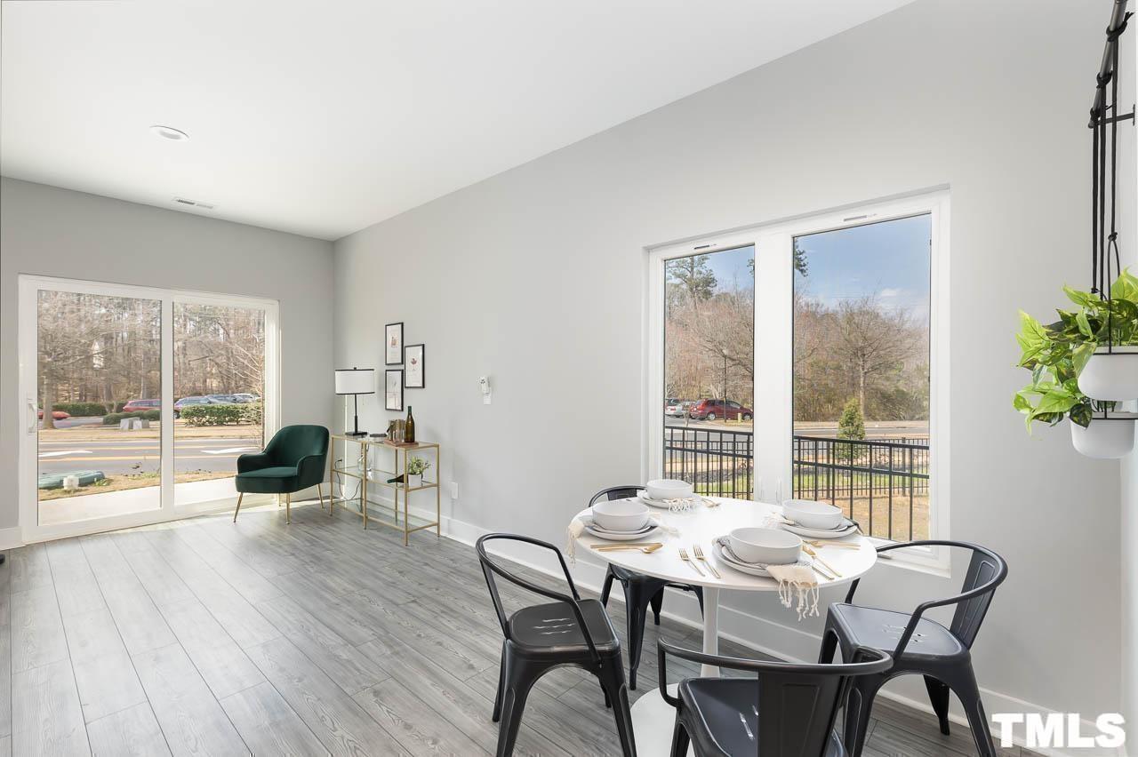 4 South Laird Drive, Unit 7 Clayton, NC 27520 - Photo 9 of 26 a view of a dining room with furniture window and wooden floor
