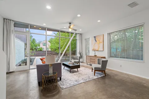 a view of a dining room with furniture window and outside view