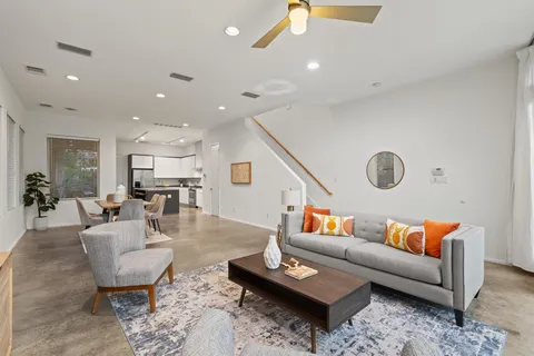 a living room with furniture and a rug