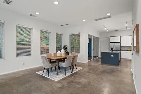 a view of a dining room with furniture and a table