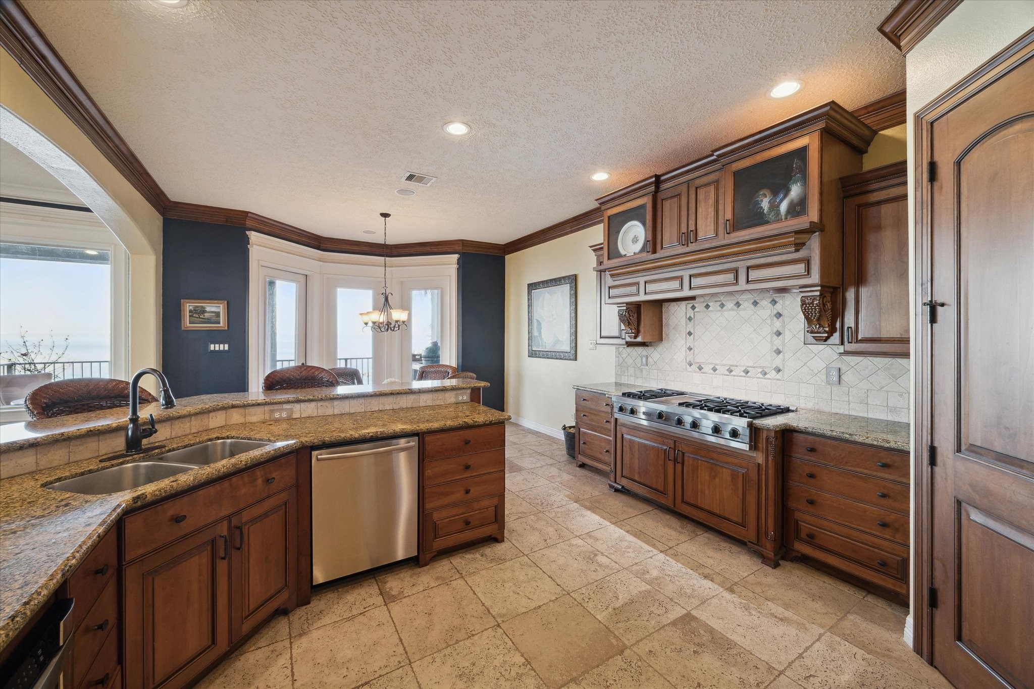 1406 Todville Road Seabrook, TX 77586 - Photo 24 of 49 HIGH END KITCHEN WITH BEAUTIFUL CUSTOM-BUILT CABINETRY WITH POT AND PAN DRAWS AND VIKING APPLIANCES INCLUDING DOUBLE OVENS.