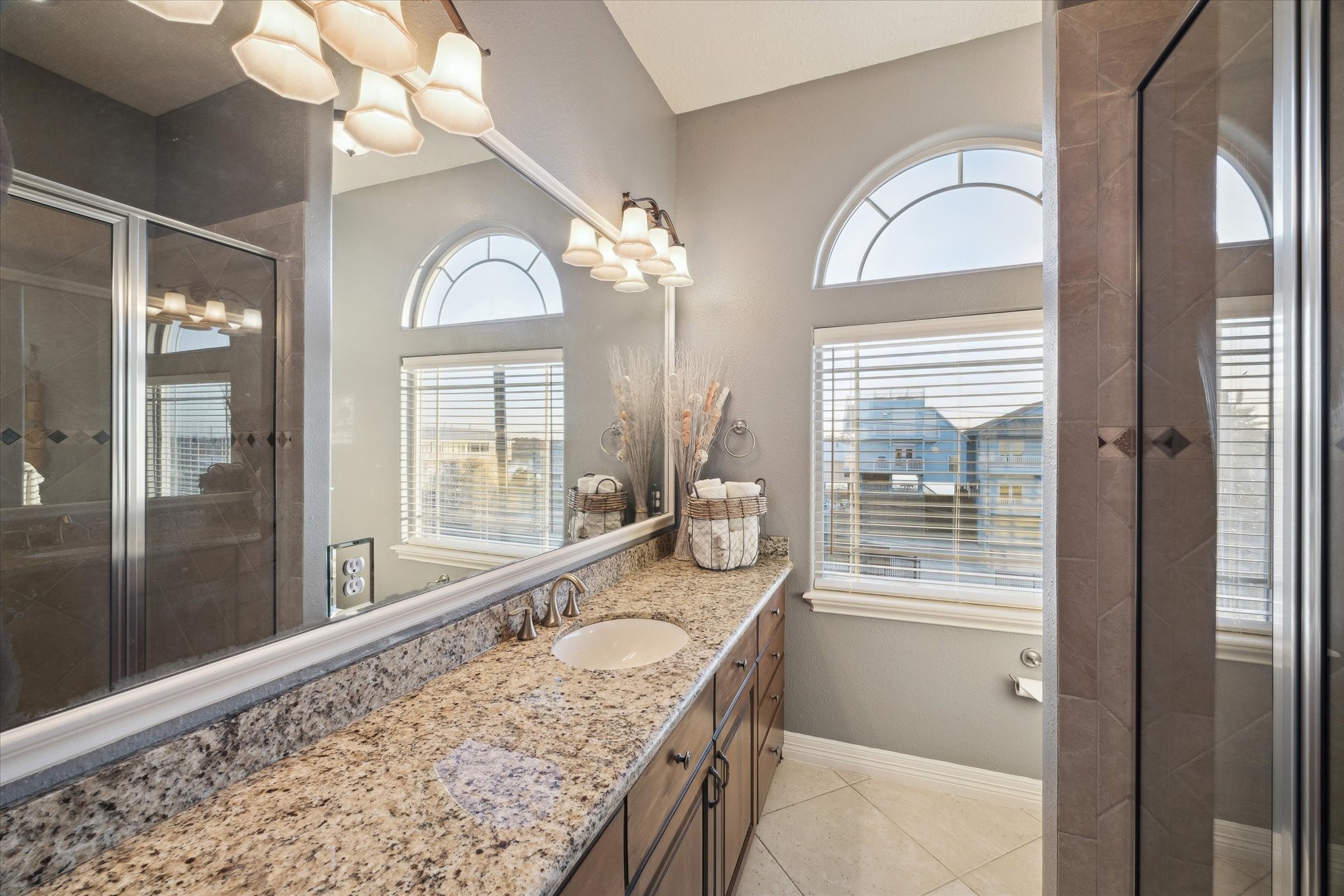 1406 Todville Road Seabrook, TX 77586 - Photo 43 of 49 NICELY FINISHED HALL BATH FOR THE GAMEROOM AND 4TH BEDROOM. FINISHES INCLUDE GRANITE COUNTERS AND A TUB WITH TILE SURROUND.