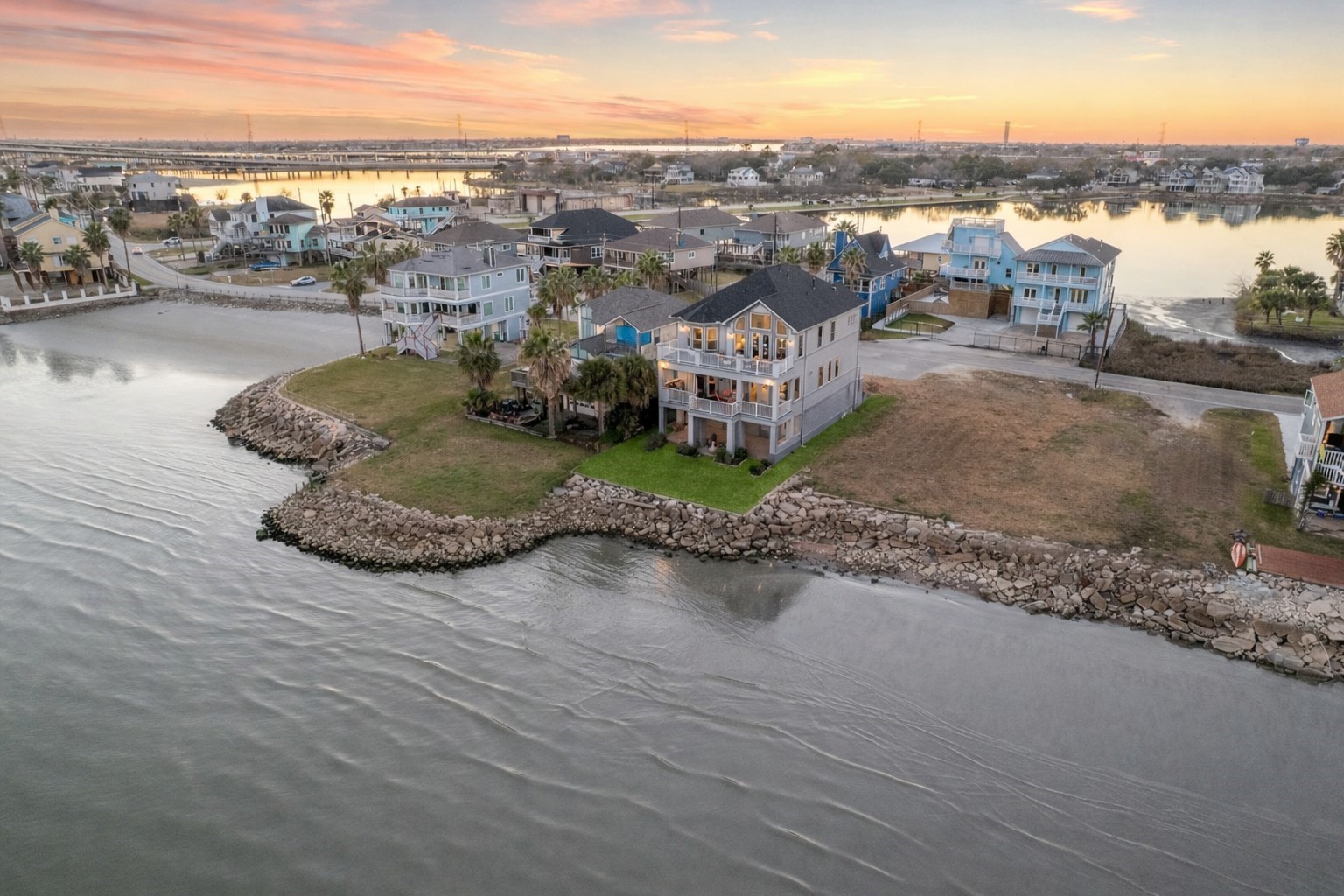 1406 Todville Road Seabrook, TX 77586 - Photo 6 of 49 SITUATED ON A POPULAR PART OF TODVILLE ROAD, YOU HAVE A QUAINT BEACH JUST STEPS AWAY AND WATER VIEWS FROM BOTH THE FRONT AND BACK OF THE PROPERTY.