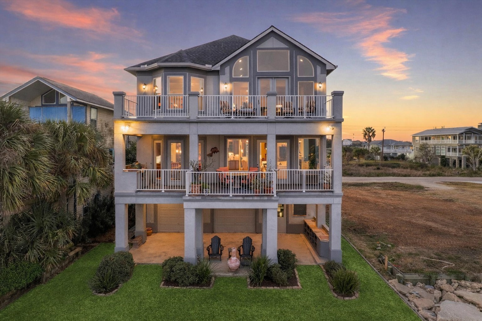 1406 Todville Road Seabrook, TX 77586 - Photo 7 of 49 THE REAR ELEVATION HIGHLIGHTS THE INCREDIBLE OUTDOOR LIVING AREAS FROM THE HUGE COVERED PATIO TO THE EXTENSIVE BALCONIES ON EACH LEVEL.