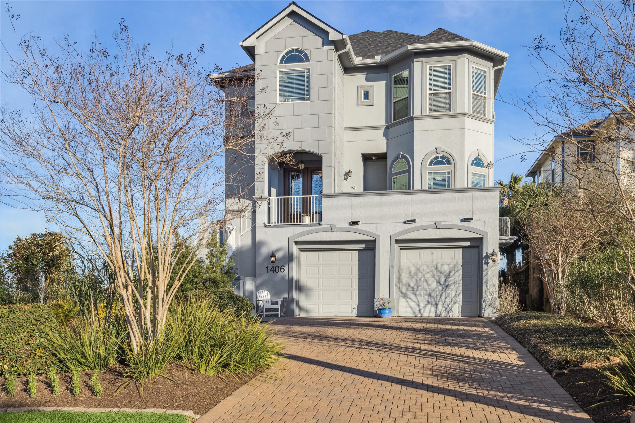 1406 Todville Road Seabrook, TX 77586 - Photo 8 of 49 A LONG, PRIVATE PAVERED DRIVEWAY OPENS TO THIS BEAUTIFUL BAYFRONT HOME.