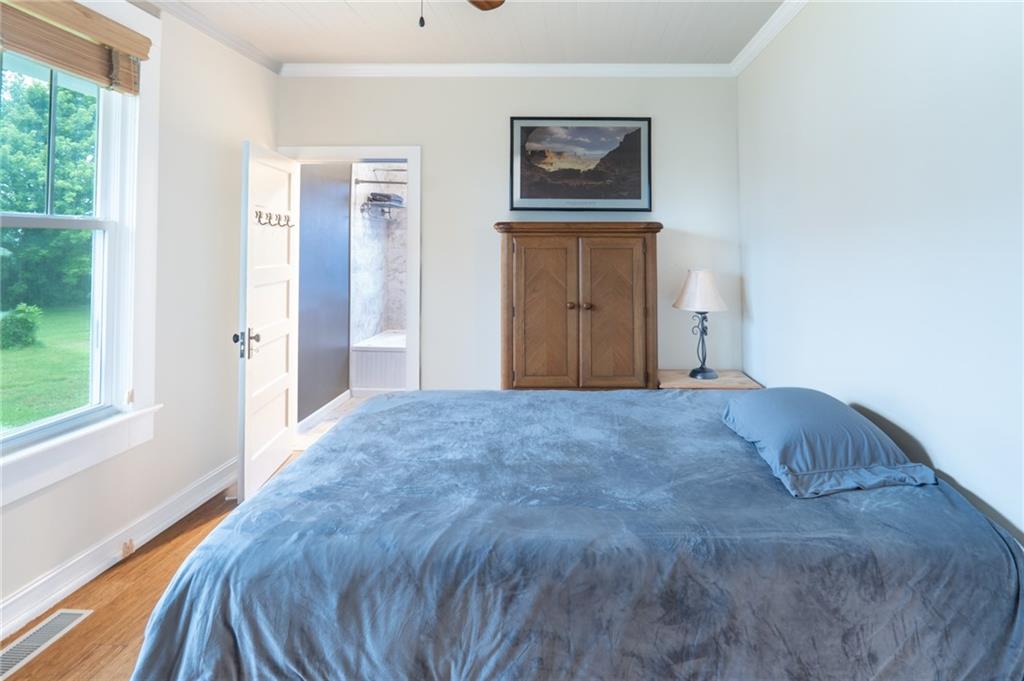 1815 Pickens Street Ball Ground, GA 30107 - Photo 11 of 38 a bedroom with a bed and a window