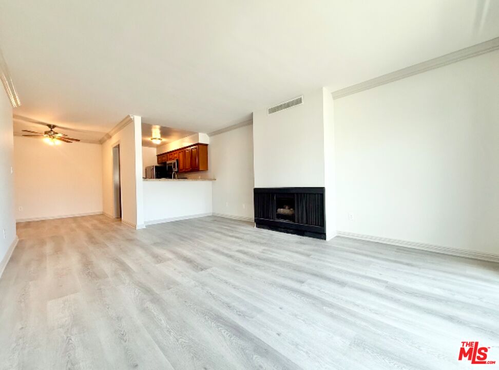 821 3rd Street, Unit 305 Santa Monica, CA 90403 - Photo 12 of 13 a view of empty room with a fireplace