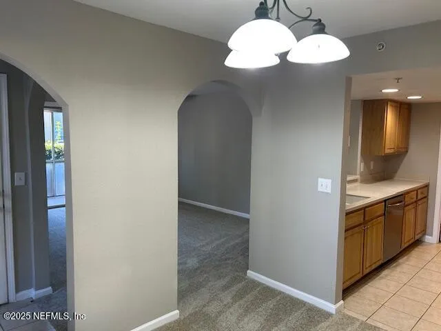 a view of a kitchen from the hallway