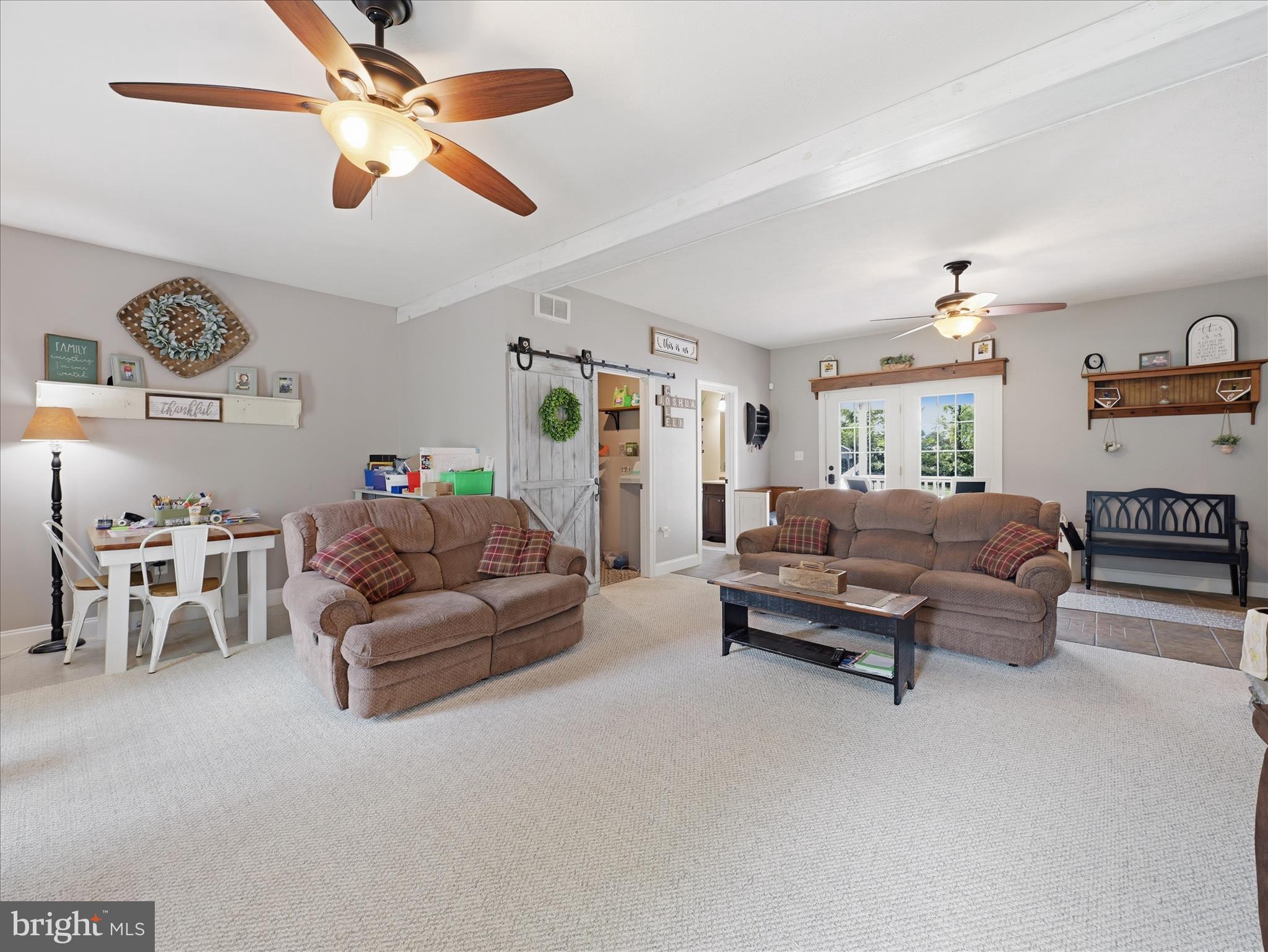 726 Doe Run Road Inwood, WV 25428 - Photo 41 of 68 a living room with furniture and a chandelier