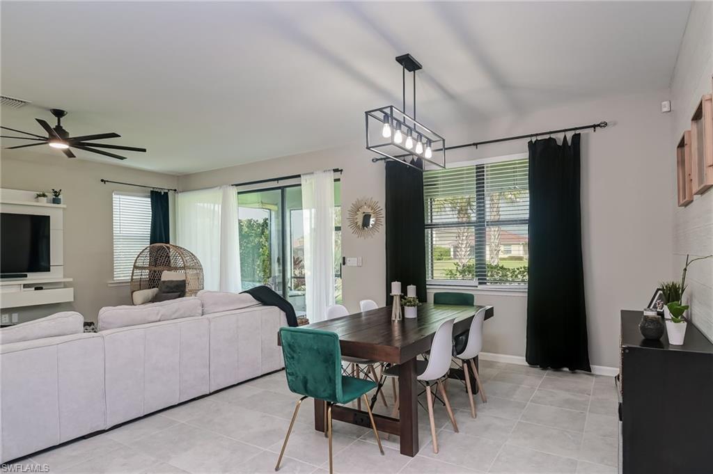 2137 Clementine Street Naples, FL 34120 - Photo 13 of 32 a view of a dining room with furniture window and outside view