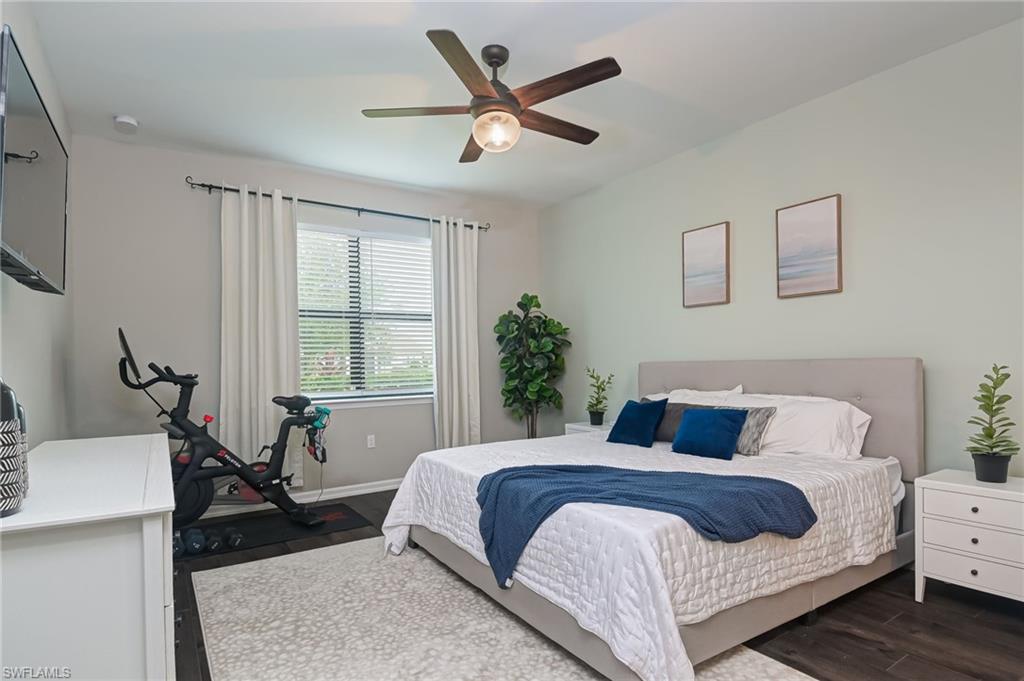 2137 Clementine Street Naples, FL 34120 - Photo 14 of 32 a bedroom with a large bed and a window