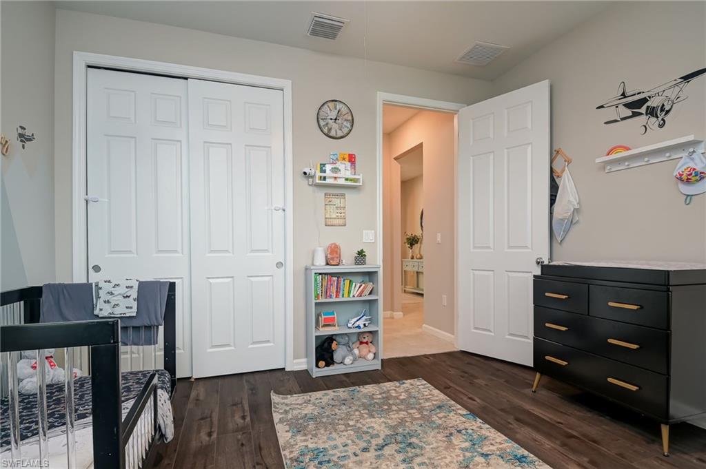 2137 Clementine Street Naples, FL 34120 - Photo 20 of 32 a view of room with furniture and wooden floor