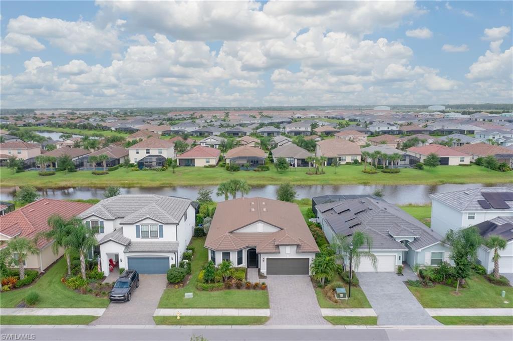 2137 Clementine Street Naples, FL 34120 - Photo 2 of 32 an aerial view of a house with outdoor space and lake view