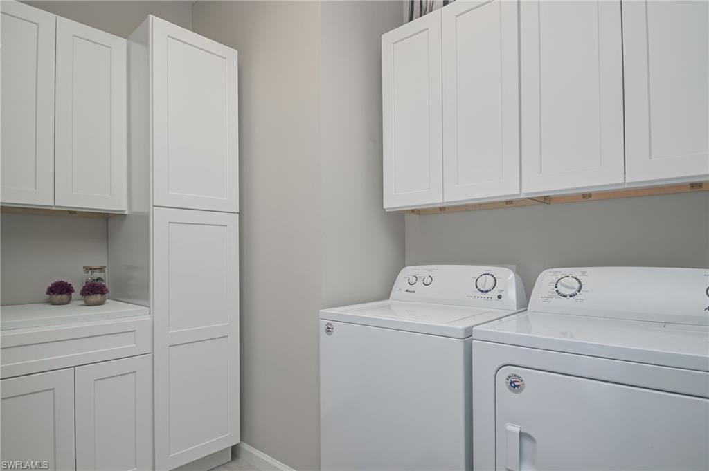 2137 Clementine Street Naples, FL 34120 - Photo 23 of 32 a view of storage and utility room with washer and dryer