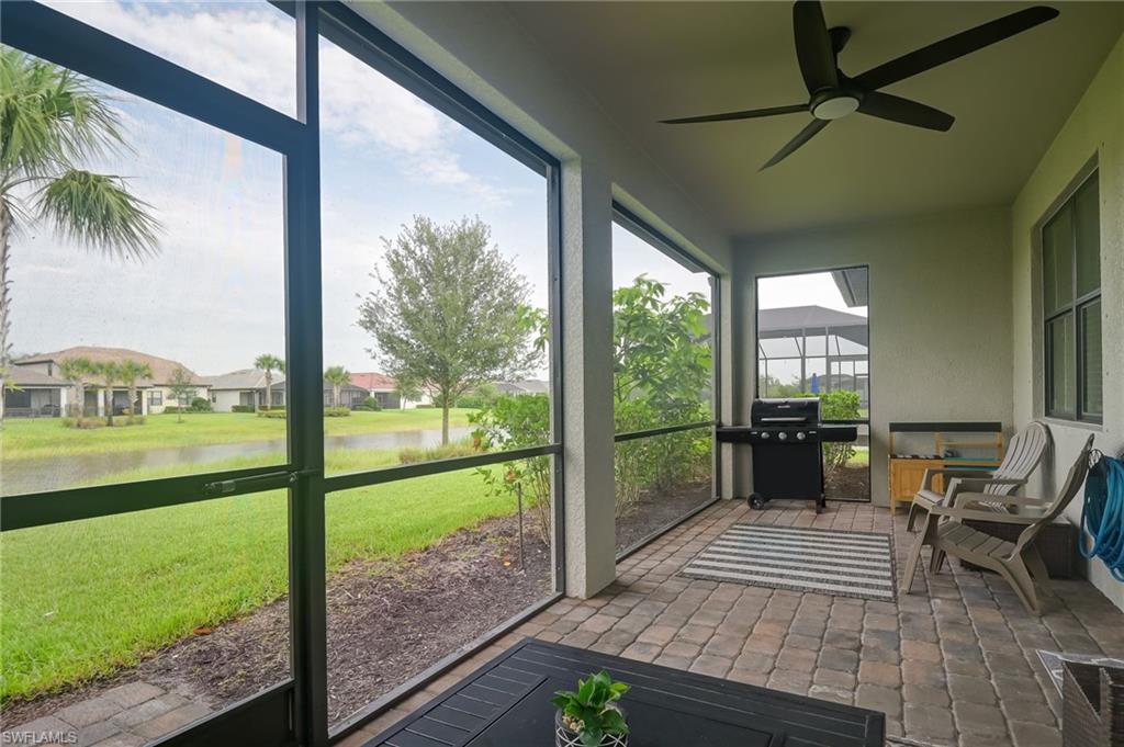 2137 Clementine Street Naples, FL 34120 - Photo 26 of 32 a view of a porch with furniture and garden