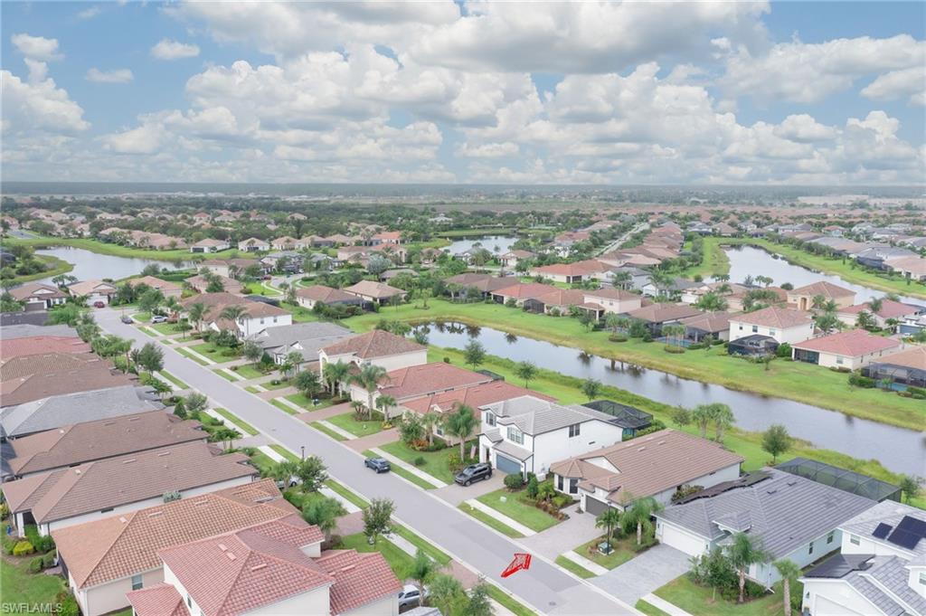 2137 Clementine Street Naples, FL 34120 - Photo 30 of 32 an aerial view of residential houses with outdoor space