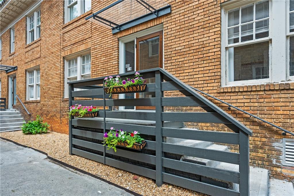 405 4th Street Northeast, Unit 24 Atlanta, GA 30308 - Photo 17 of 19 a side view of a house with a yard