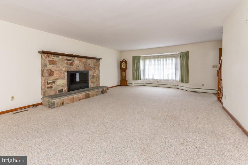 206 Friendship Road Elkton, MD 21921 - Photo 4 of 30 Local Fieldstone Fireplace with Natural Gas Insert