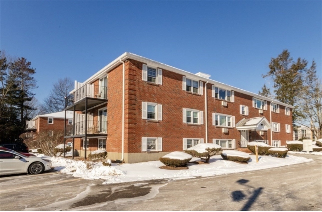 a view of a parked cars in front of a building