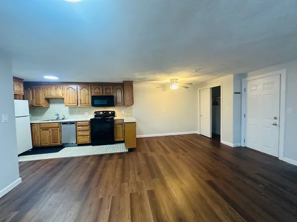 a kitchen with stainless steel appliances granite countertop a stove and a sink