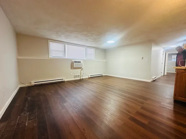 an empty room with wooden floor