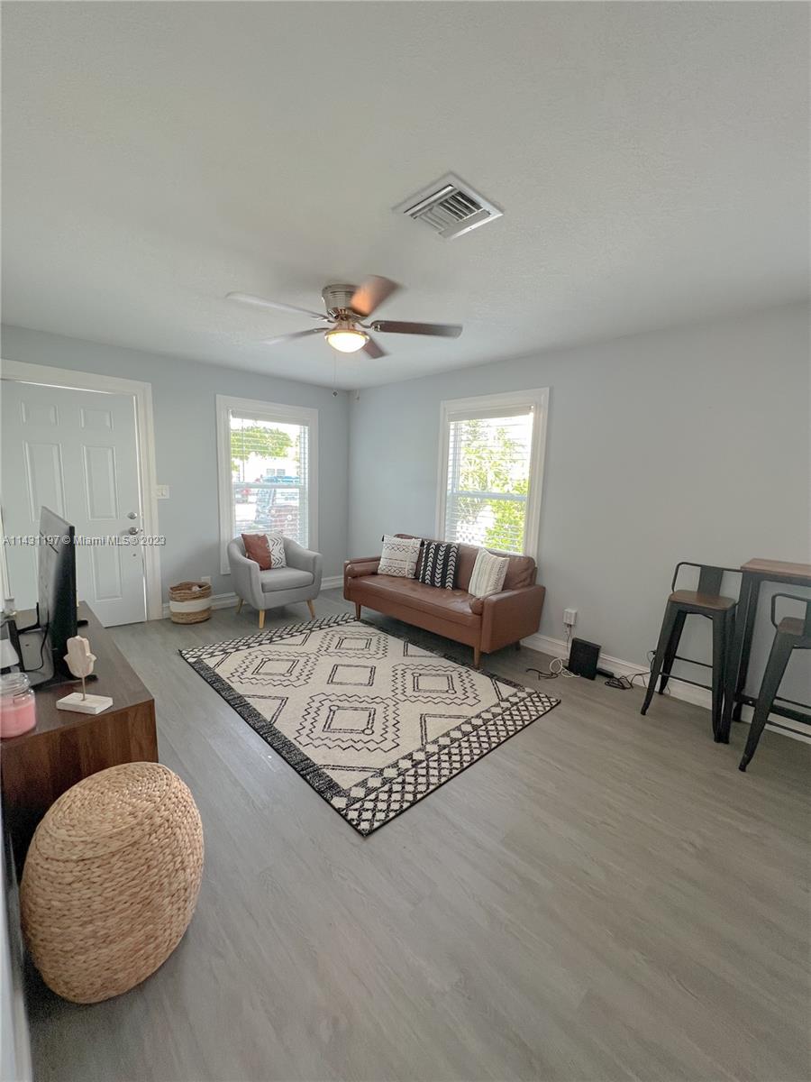 515 Valley Forge Road West Palm Beach, FL 33405 - Photo 7 of 9 a living room with furniture and a wooden floor