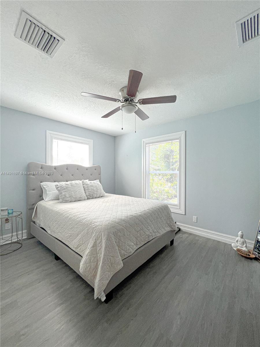 515 Valley Forge Road West Palm Beach, FL 33405 - Photo 8 of 9 a bedroom with a bed and window