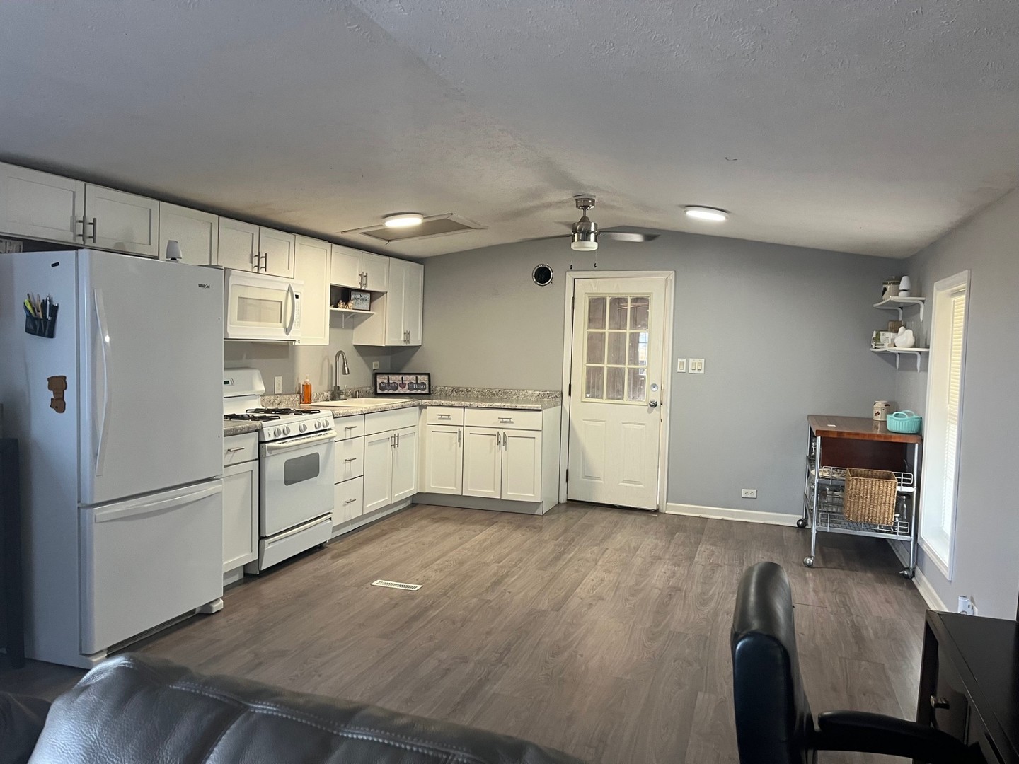 3770 East 1050th Road Earlville, IL 60518 - Photo 3 of 11 a kitchen with stainless steel appliances a refrigerator sink and cabinets