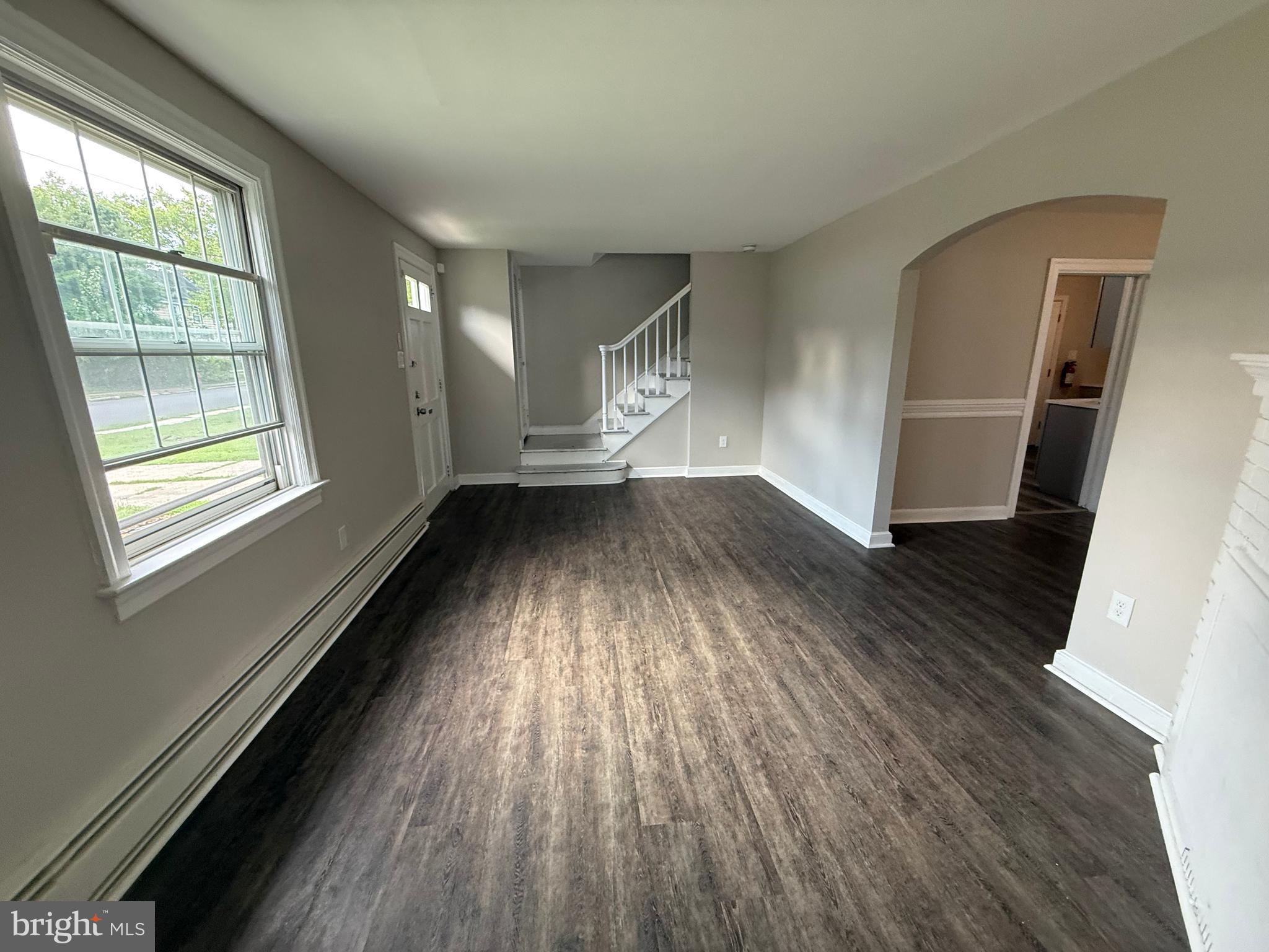 17 Wayne Road Bridgeton, NJ 08302 - Photo 17 of 49 wooden floor in an empty room with a window