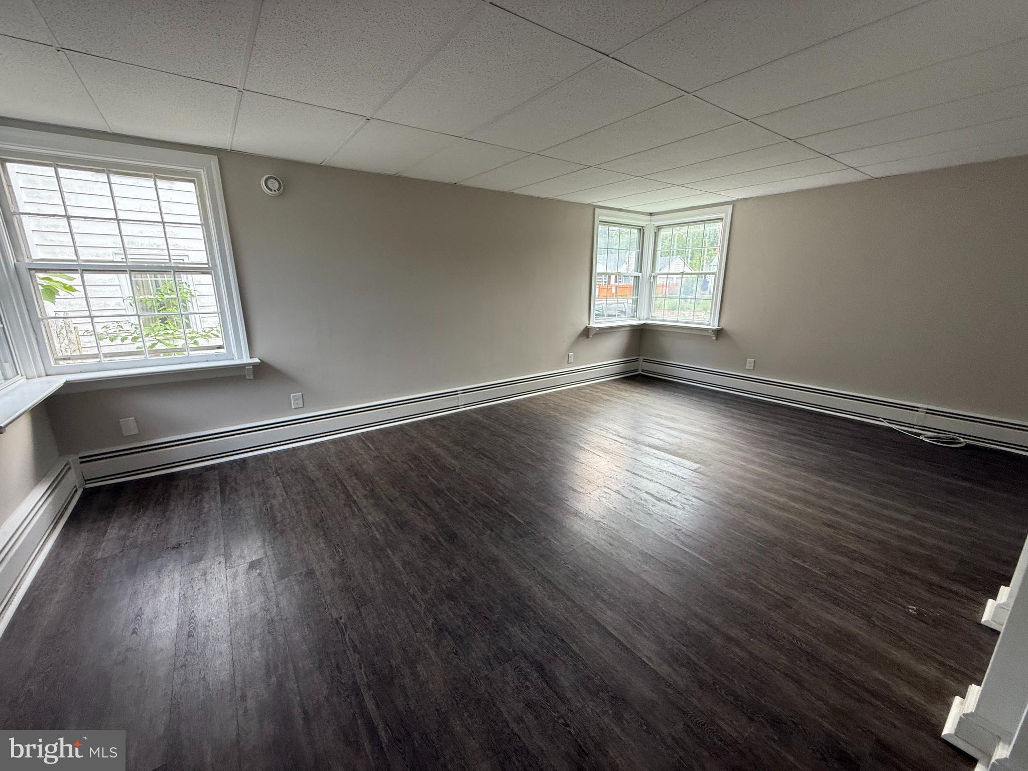 17 Wayne Road Bridgeton, NJ 08302 - Photo 20 of 49 an empty room with wooden floor and windows