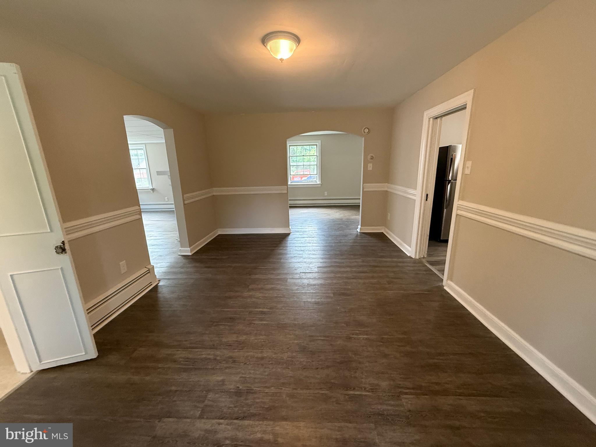 17 Wayne Road Bridgeton, NJ 08302 - Photo 22 of 49 wooden floor in an empty room with a fireplace