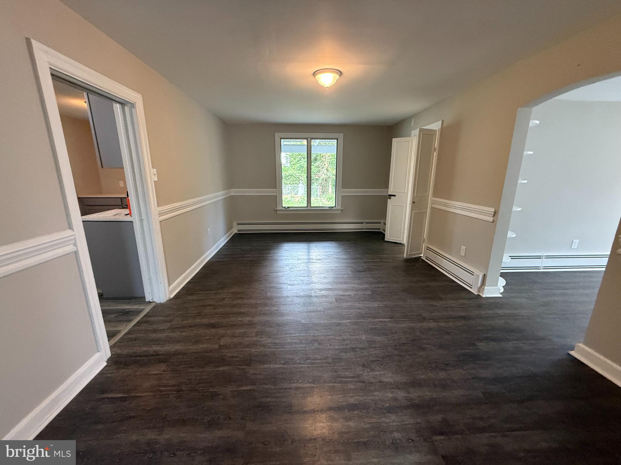 17 Wayne Road Bridgeton, NJ 08302 - Photo 23 of 49 an empty room with wooden floor and windows