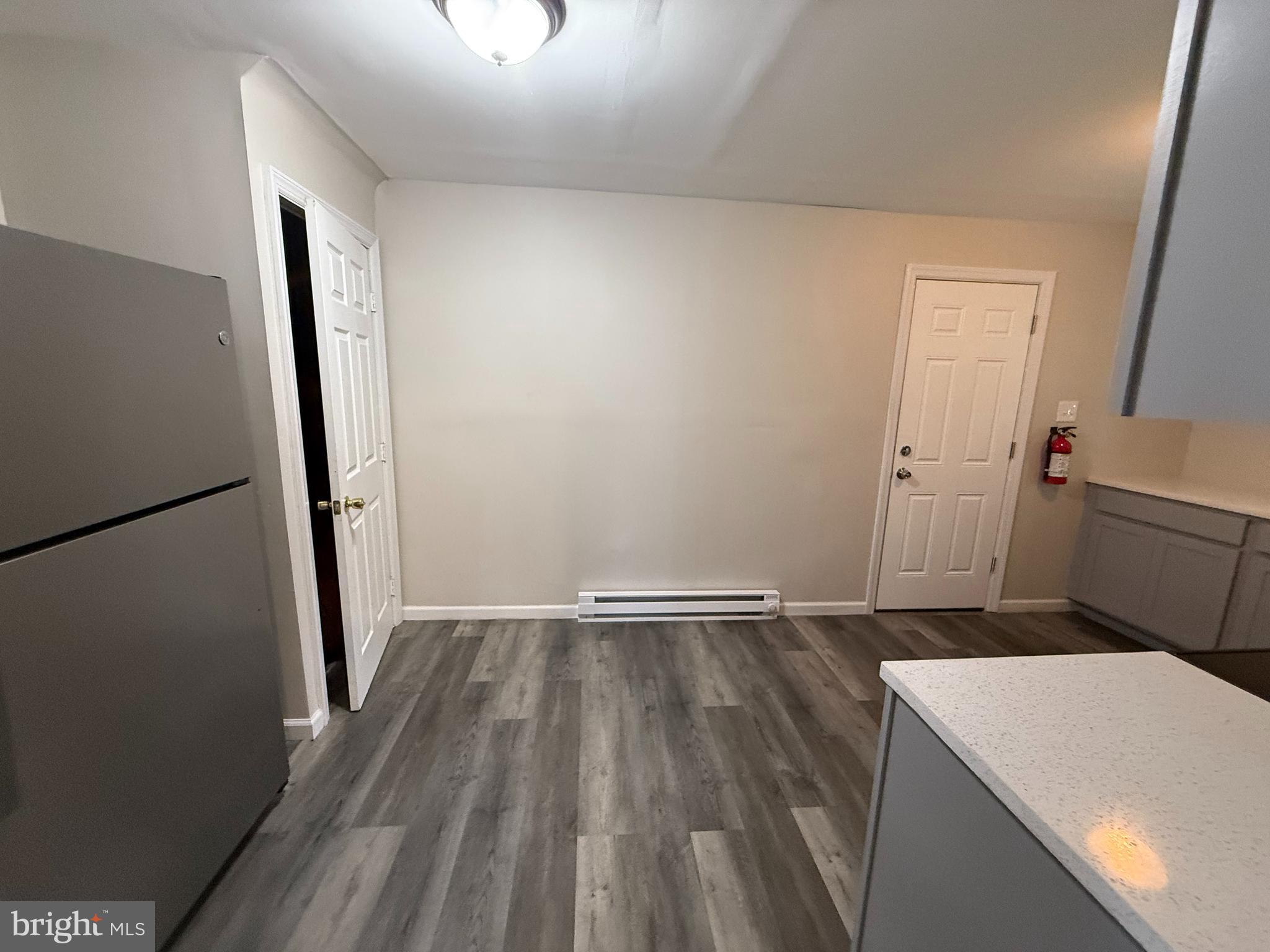 17 Wayne Road Bridgeton, NJ 08302 - Photo 24 of 49 an empty room with wooden floor and a sink