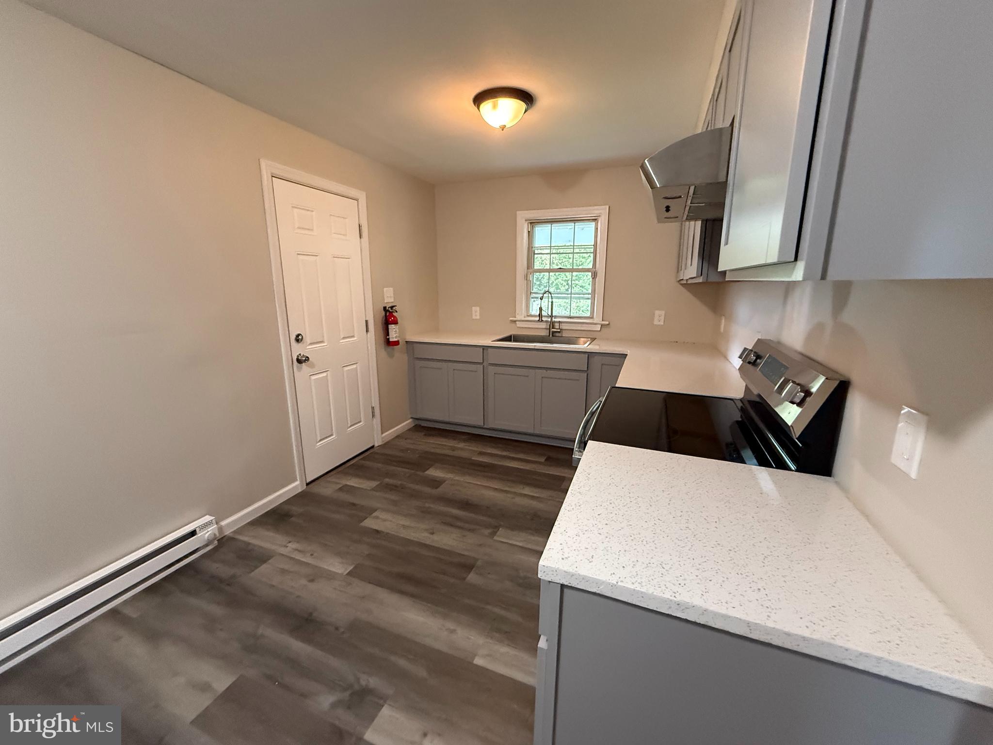 17 Wayne Road Bridgeton, NJ 08302 - Photo 25 of 49 a kitchen that has a sink and a stove in it