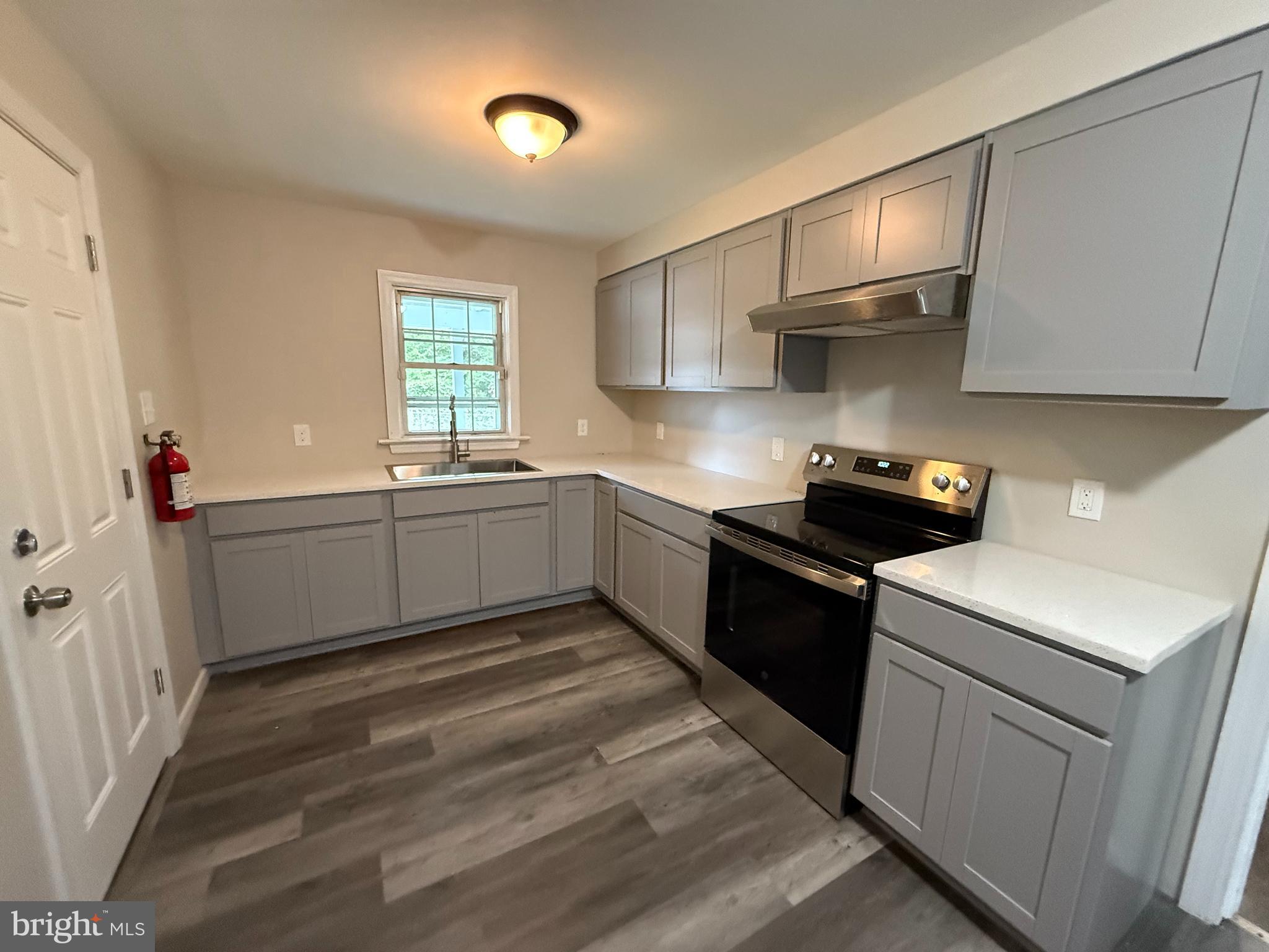 17 Wayne Road Bridgeton, NJ 08302 - Photo 26 of 49 a kitchen that has a sink and a stove in it