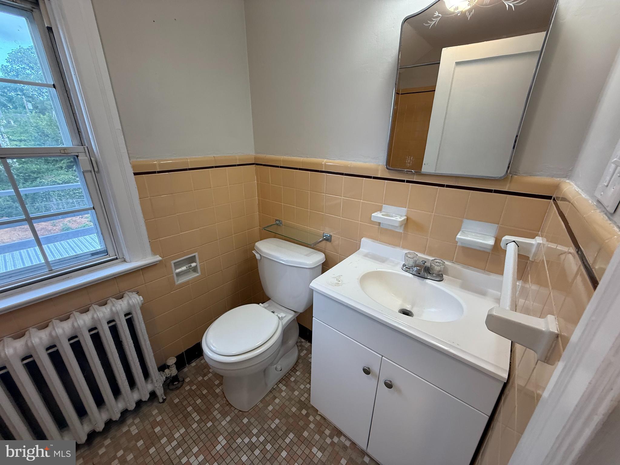 17 Wayne Road Bridgeton, NJ 08302 - Photo 35 of 49 a bathroom with a sink a toilet and a mirror