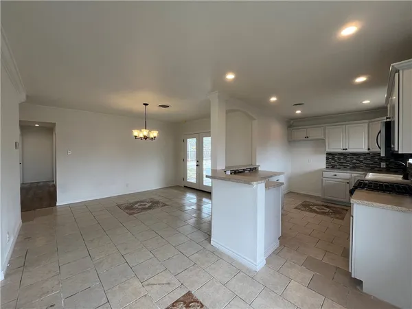 a kitchen with kitchen island cabinets and window