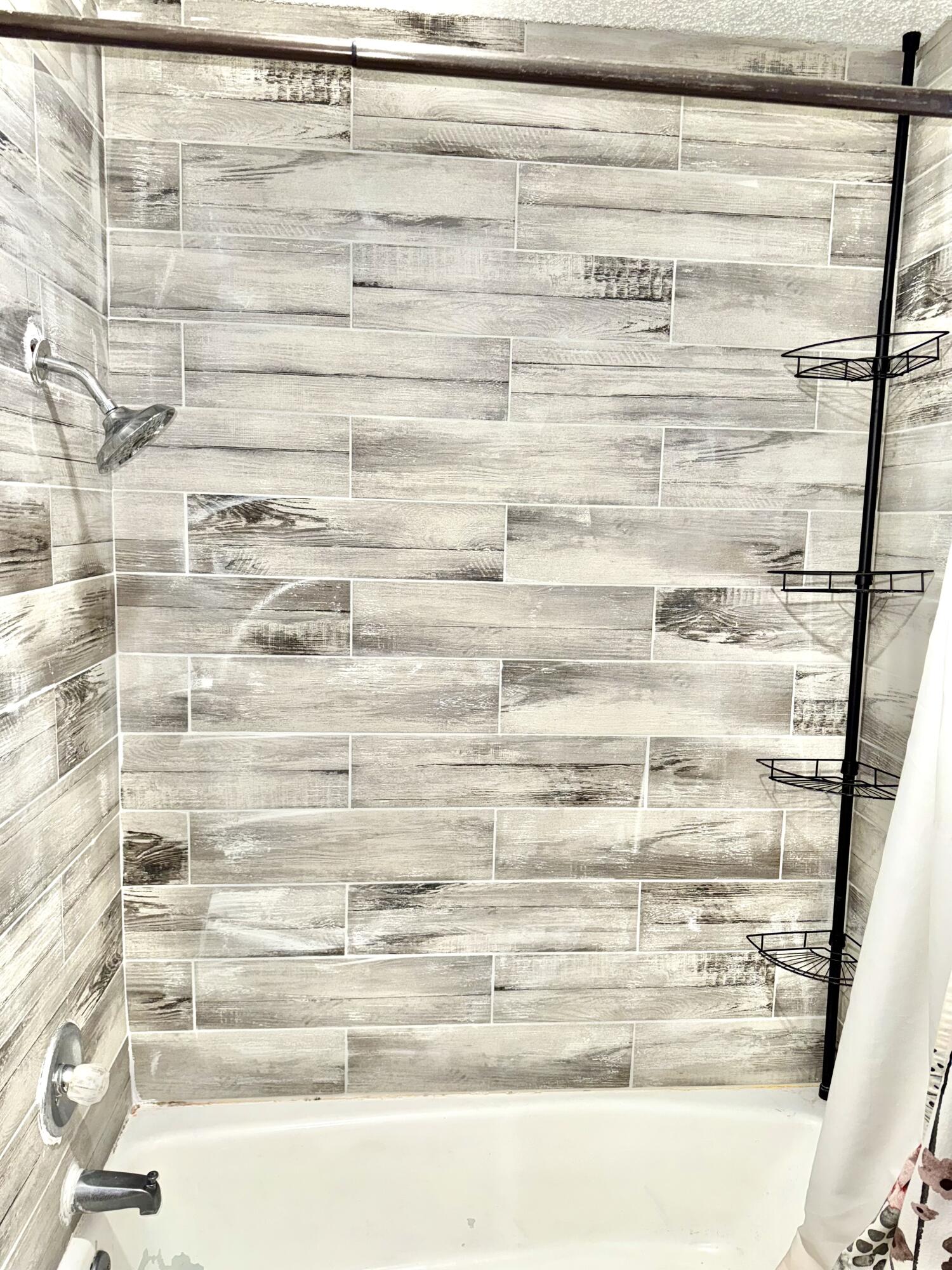 5415 73rd Street Lubbock, TX 79424 - Photo 6 of 13 a close up of a shower