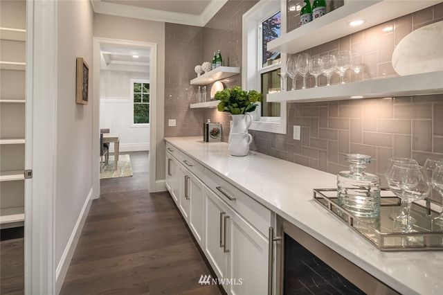 a kitchen with sink and cabinets