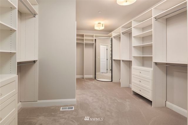 a view of an empty walk in closet