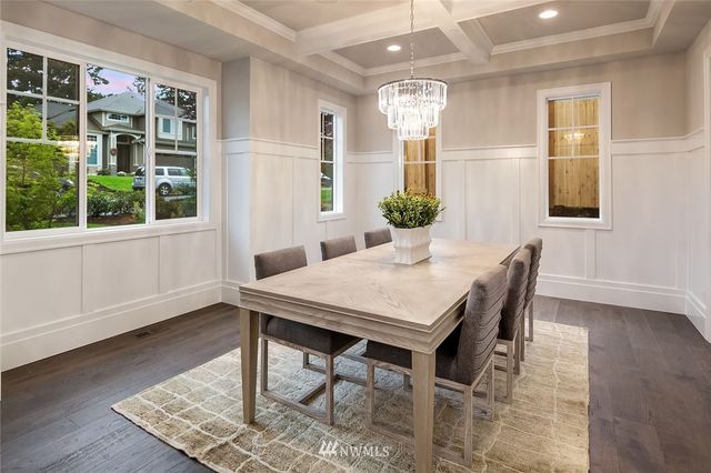 a view of a dining room with furniture and window